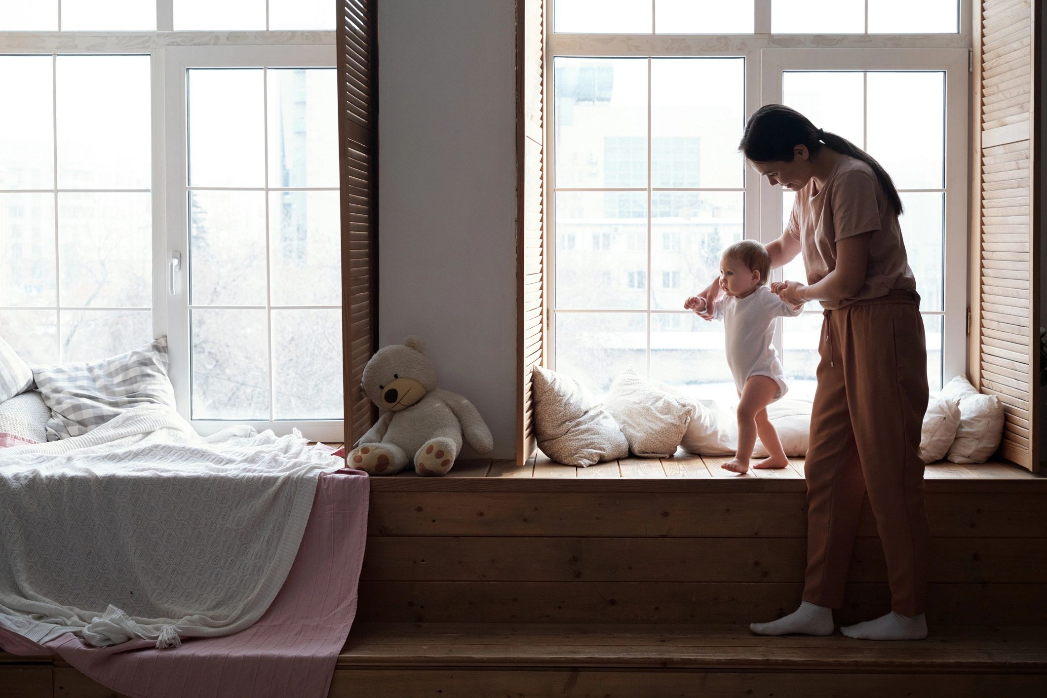 Mother spending time with young child at home